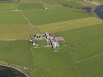 Oblique aerial view centred on Burness farm, taken from the S.