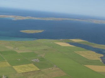 General oblique aerial view from the N end of Stronsay looking towards the Holm of Huip and Spurness Sound, taken from the SSE.