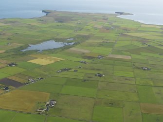 General oblique aerial view looking towards the SW end of Stronsay to Lamb Head with Meikle Water to the left, taken from the NE.