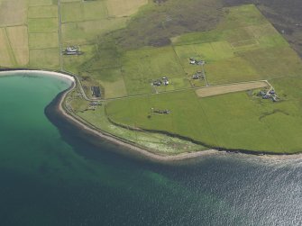 Oblique aerial view centred on Longbigging farmstead with feeder bin stances visible on the shoreline adjacent, taken from the NW.