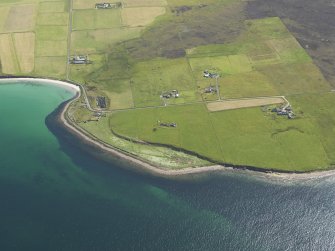 Oblique aerial view centred on Longbigging farmstead with feeder bin stances visible on the shoreline adjacent, taken from the NW.