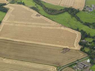 General oblique aerial view of the henge and square barrow under excavation in 2009, taken from the E.
