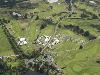 Oblique aerial view of Gleneagles golf courses, taken from the NW.