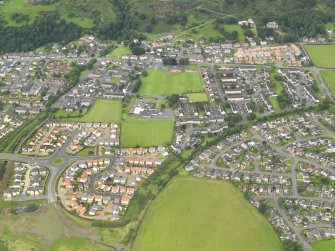General oblique aerial view of Menstrie village, taken from the SSE.