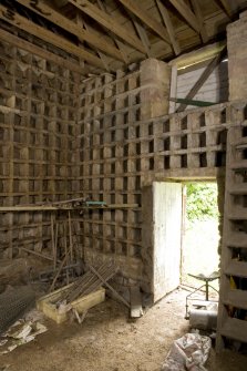 Interior. View from NW showing nesting boxes and roof structure