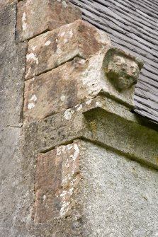 Detail of quoin with date and carved head