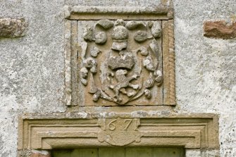 Detail of lintel with date stone (1671) and heraldic panel above entrance