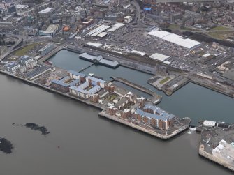 General oblique aerial view of the new development in Dundee harbour, taken from the SE.