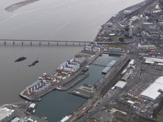 General oblique aerial view of the new development in Dundee harbour, taken from the NE.