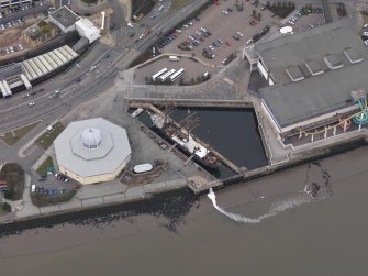 Oblique aerial view of the Old Dundee harbour centred on the Discovery, taken from the S.