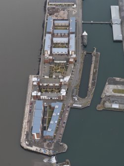 General oblique aerial view of the new development in Dundee harbour, taken from the NE.