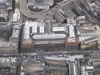 General oblique aerial view of Chambers Street centred on the Royal Museum of Scotland, taken from the N.