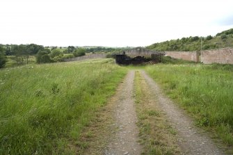 View from E with large hay shed in distance