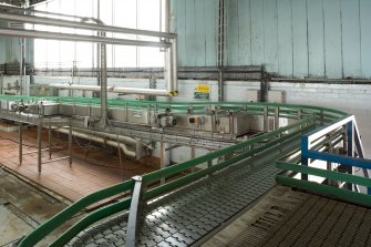 Bottling Plant. Interior. Bottling linebetween bulk glass de-palletiser and rinser