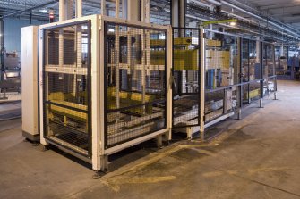 Bottling Plant. Interior. View from south west the palletiser with shrink wrapper beyond.