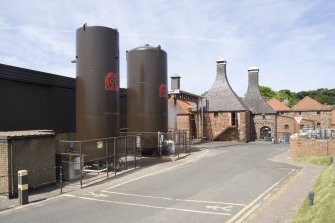 Belhaven Brewery. View from south east of bottling plant to left and carbon dioxide and nitrogen towers on right. The former grain drying kilns are on the right with the former maltings behind.