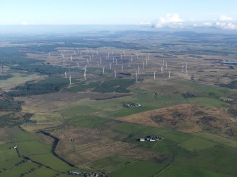 General oblique aerial view looking across Bogside and Gair farms towards Hare Hill and Black Law A wind farm, taken from the WSW.