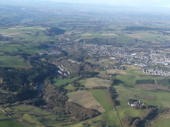 General oblique aerial view looking down the River Clyde with Lanark and New Lanark village in the middle distance, taken from the SSE.