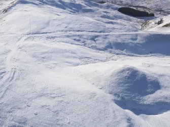 Oblique aerial view of the Roman road in snow, looking WSW.