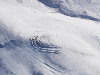 Oblique aerial view of fort and cord rig under snow, looking to S.