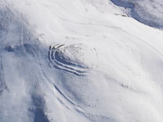 Oblique aerial view of fort and cord rig under snow, looking to SSE.