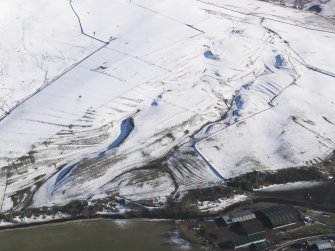 General oblique aerial view of the rig and cultivation terraces under snow, looking to ESE.