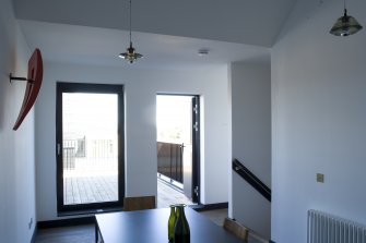 Interior view of Plot 2, The Stone House by NORD Architects.