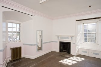 Interior. 2nd floor , View of corner room showing fireplace and dado