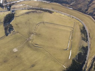 Oblique aerial view of Lyne Roman fort, looking SSE.