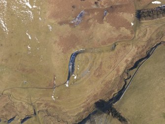 Oblique aerial view of Mossfennan fort and scooped settlement, settlement, and cultivation terraces, looking NE.