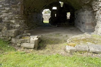 Sacristy, E entrance, view of footings from E