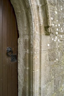 Slype, E doorway, detail of roll moulding and corbel