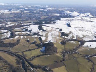 General oblique aerial view of the Tweed with the Eildon Hills in the distance, looking ESE.
