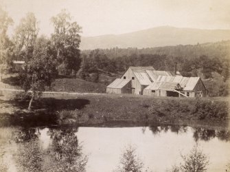 View of wooden buildings at Kinrara, near Aviemore. 
