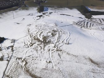 Oblique aerial view of the fort and settlements on Bonchester Hill, looking WNW.