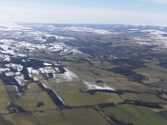 General oblique aerial view with Hawick in the distance, looking WSW.