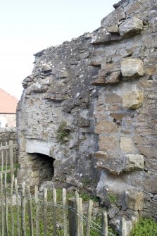 Remains of cloister wall and cellar, view from SW