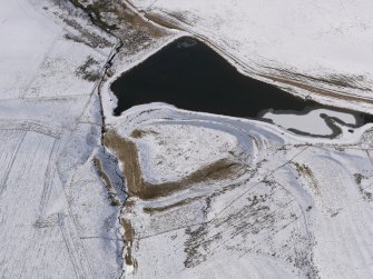Oblique aerial view of the snow-covered remains of the fort at Green Castle, taken from the SE.