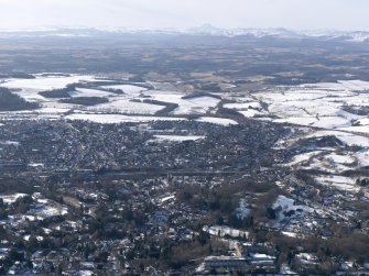 General oblique aerial view of Dunblane with the mountains beyond, looking W.