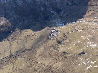 Oblique aerial view of the farmsteads, looking WSW.