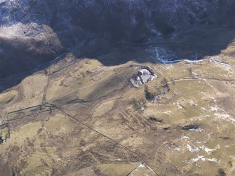 Oblique aerial view of the farmsteads, looking WSW.