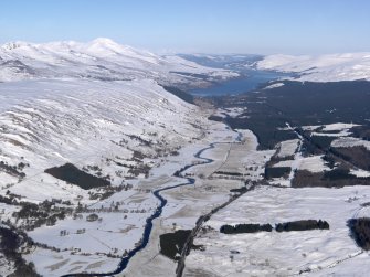 General oblique aerial view of Glen Dochart under snow with Killin and Loch Tay in the distance, looking ENE.