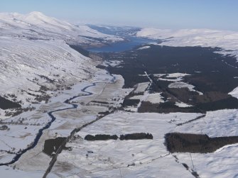 General oblique aerial view of Glen Dochart under snow with Killin and Loch Tay in the distance, looking ENE.