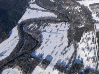 Oblique aerial view of Taymouth Castle and golf course under snow, looking NNE.