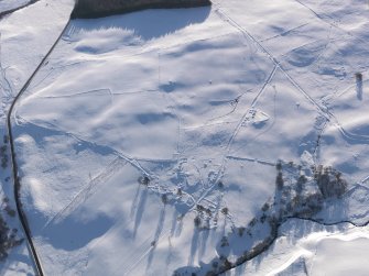 Oblique aerial view of the townships and the military road, looking WSW.