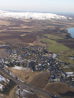 General oblique aerial view of Milnathort with the Lomond Hills beyond, looking WSW.