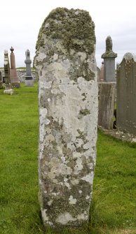 View of stone with carved cross (daylight)