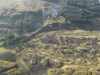 Oblique aerial view of the remains of the Wilsontown mine workings after clearance of trees, taken from the ENE.