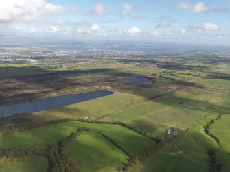 General oblique aerial view looking across the peat works at Gardrum Moss towards Grangemouth, taken from the SW.