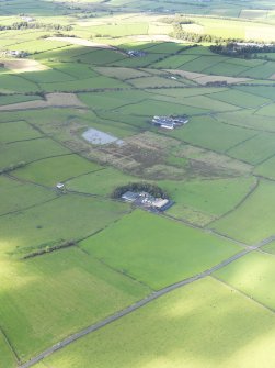 Oblique aerial view centred on the farmhouse, taken from the SE.